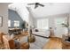 Bright living room with hardwood floors, vaulted ceiling and open to the dining room at 1290 S Elizabeth St, Denver, CO 80210