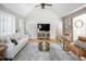 Cozy living room featuring hardwood floors, vaulted ceilings, and contemporary furnishings at 1290 S Elizabeth St, Denver, CO 80210