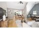 Open living area showcases hardwood floors, comfortable seating, and easy access to the well-lit modern kitchen at 1290 S Elizabeth St, Denver, CO 80210