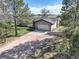 Overhead view of a charming single-story home featuring an attached garage, driveway, and well-maintained lawn at 2166 Appaloosa Trl, Elizabeth, CO 80107