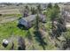 Overhead view captures the home's setting amidst lush trees and landscaping, showcasing a serene environment at 2166 Appaloosa Trl, Elizabeth, CO 80107