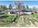 Aerial view showcases the home's backyard with mature trees, lawn, fence, and exterior at 2166 Appaloosa Trl, Elizabeth, CO 80107