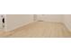 Finished basement with wood grain flooring and white walls at 2166 Appaloosa Trl, Elizabeth, CO 80107
