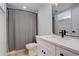 Updated bathroom featuring black fixtures and white cabinets at 2166 Appaloosa Trl, Elizabeth, CO 80107