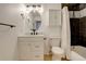 Bathroom featuring modern fixtures, a vanity with storage, and a shower with patterned tile and a shower curtain at 2166 Appaloosa Trl, Elizabeth, CO 80107