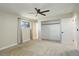 Bright bedroom with a ceiling fan, closet, and an ensuite bathroom at 2166 Appaloosa Trl, Elizabeth, CO 80107