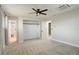 Bright bedroom with a ceiling fan, closet, and an ensuite bathroom with a shower at 2166 Appaloosa Trl, Elizabeth, CO 80107