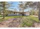 Inviting single-story home boasts mature trees, a well-maintained lawn, and a welcoming front entrance at 2166 Appaloosa Trl, Elizabeth, CO 80107