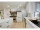 Well-lit kitchen featuring stainless steel appliances, modern countertops, and plenty of cabinet space for storage at 2166 Appaloosa Trl, Elizabeth, CO 80107