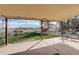 Covered patio features outdoor seating and expansive views of the fenced backyard and surrounding rural landscape at 2166 Appaloosa Trl, Elizabeth, CO 80107