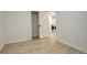 An empty room with white walls and a door open to a laundry room at 2166 Appaloosa Trl, Elizabeth, CO 80107