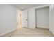 An empty room with white walls and a door open to another room at 2166 Appaloosa Trl, Elizabeth, CO 80107