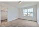 Cozy bedroom with carpet, closet, and a window, providing natural light at 28625 E 6Th Pl, Watkins, CO 80137