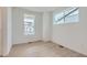 Bright bedroom with hardwood floors and large windows offering ample natural light at 28625 E 6Th Pl, Watkins, CO 80137