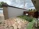 Small backyard featuring a mix of stone pavers and grass, along with a weathered fence at 528 S Youngfield Ct, Denver, CO 80228