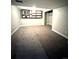 Spacious basement with a window and shelving, ready for customization into a living or storage space at 528 S Youngfield Ct, Denver, CO 80228