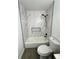 Well-lit bathroom showcasing a tiled shower and tub, offering a clean and modern look at 528 S Youngfield Ct, Denver, CO 80228