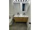 Inviting bathroom showcasing a double vanity with unique fixtures and ample counter space at 528 S Youngfield Ct, Denver, CO 80228