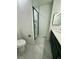 This modern bathroom offers a toilet and a black-framed glass shower enclosure at 528 S Youngfield Ct, Denver, CO 80228