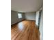A spacious bedroom featuring hardwood floors and a large window at 528 S Youngfield Ct, Denver, CO 80228