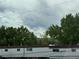Exterior shot of home with vinyl siding and mature trees at 528 S Youngfield Ct, Denver, CO 80228