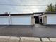Exterior view of a two-car garage with white doors and brick accents at 528 S Youngfield Ct, Denver, CO 80228