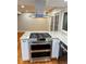 This kitchen features stainless steel appliances and ample counter space at 528 S Youngfield Ct, Denver, CO 80228