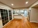 Open-concept kitchen with stainless steel appliances and hardwood floors at 528 S Youngfield Ct, Denver, CO 80228