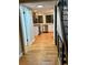 Bright kitchen with white cabinets, stainless steel appliances and hardwood floors at 528 S Youngfield Ct, Denver, CO 80228