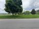 View of the community park with playground equipment and mature trees at 528 S Youngfield Ct, Denver, CO 80228