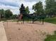 Community playground featuring a large, elevated playset with slides and climbing structures at 528 S Youngfield Ct, Denver, CO 80228