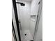 A close up of the shower featuring white tile, a black showerhead, and niche at 528 S Youngfield Ct, Denver, CO 80228