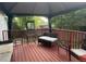 Relaxing covered deck with outdoor furniture, creating an inviting space for leisure at 3220 W 133Rd Cir, Broomfield, CO 80020