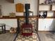 Red fireplace feature with decorative tile surround and rustic mantel at 3220 W 133Rd Cir, Broomfield, CO 80020