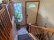 Charming foyer with decorative window and staircase to the upper level at 3220 W 133Rd Cir, Broomfield, CO 80020