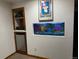 Game room with a colorful aquarium, built-in shelving, and a mini fridge for entertainment at 3220 W 133Rd Cir, Broomfield, CO 80020