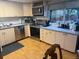 Well-lit kitchen featuring stainless steel appliances and a view to the deck outside at 3220 W 133Rd Cir, Broomfield, CO 80020
