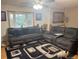 Bright living room featuring a large sectional sofa and a unique patterned rug at 3220 W 133Rd Cir, Broomfield, CO 80020