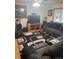 Cozy living room features a large sectional sofa and entertainment center at 3220 W 133Rd Cir, Broomfield, CO 80020