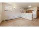 Basement with wood-look flooring, cabinets, and a refrigerator at 3581 Gap Rd, Golden, CO 80403