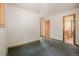 Bedroom featuring neutral walls, wood trim and carpeted flooring at 3581 Gap Rd, Golden, CO 80403