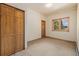 Bedroom with closet and a window offering natural light and views of the outside at 3581 Gap Rd, Golden, CO 80403