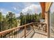 Spacious wood deck overlooks serene natural landscapes and mountain views at 3581 Gap Rd, Golden, CO 80403