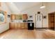 Bright kitchen with lots of counter space, wood cabinets, and a window overlooking the trees at 3581 Gap Rd, Golden, CO 80403