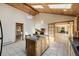 Open kitchen layout with island, skylights, and seamless access to the adjacent living spaces at 3581 Gap Rd, Golden, CO 80403