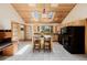 Bright kitchen with light wood cabinets, an island, and natural light from skylights and a window at 3581 Gap Rd, Golden, CO 80403