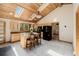 Inviting kitchen with light cabinets, an island, tile flooring, skylights, and modern appliances at 3581 Gap Rd, Golden, CO 80403