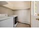 Functional laundry room equipped with appliances and offering extra space for storage at 3581 Gap Rd, Golden, CO 80403