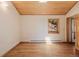 Bright living room with a wood ceiling, wood flooring, and large windows at 3581 Gap Rd, Golden, CO 80403