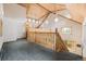 Loft area with lots of natural light and a wooden railing overlooking the living room at 3581 Gap Rd, Golden, CO 80403